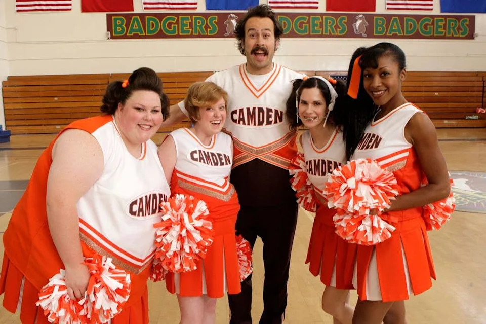 Chrissy Metz in a cheerleading costume with the cast of My Name is Earl