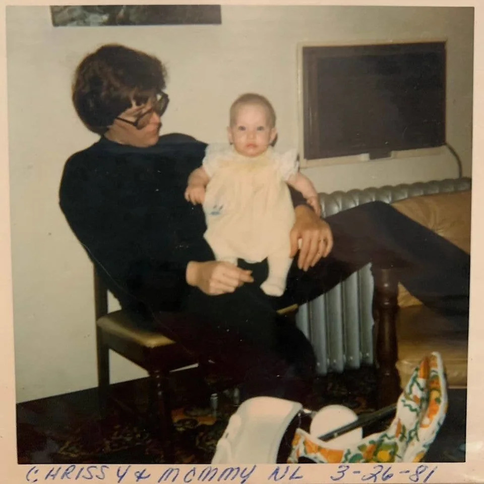 Chrissy Metz in a throwback baby photo with her mom, she is a tiny baby sitting on her mother's knee in a 70s looking photo