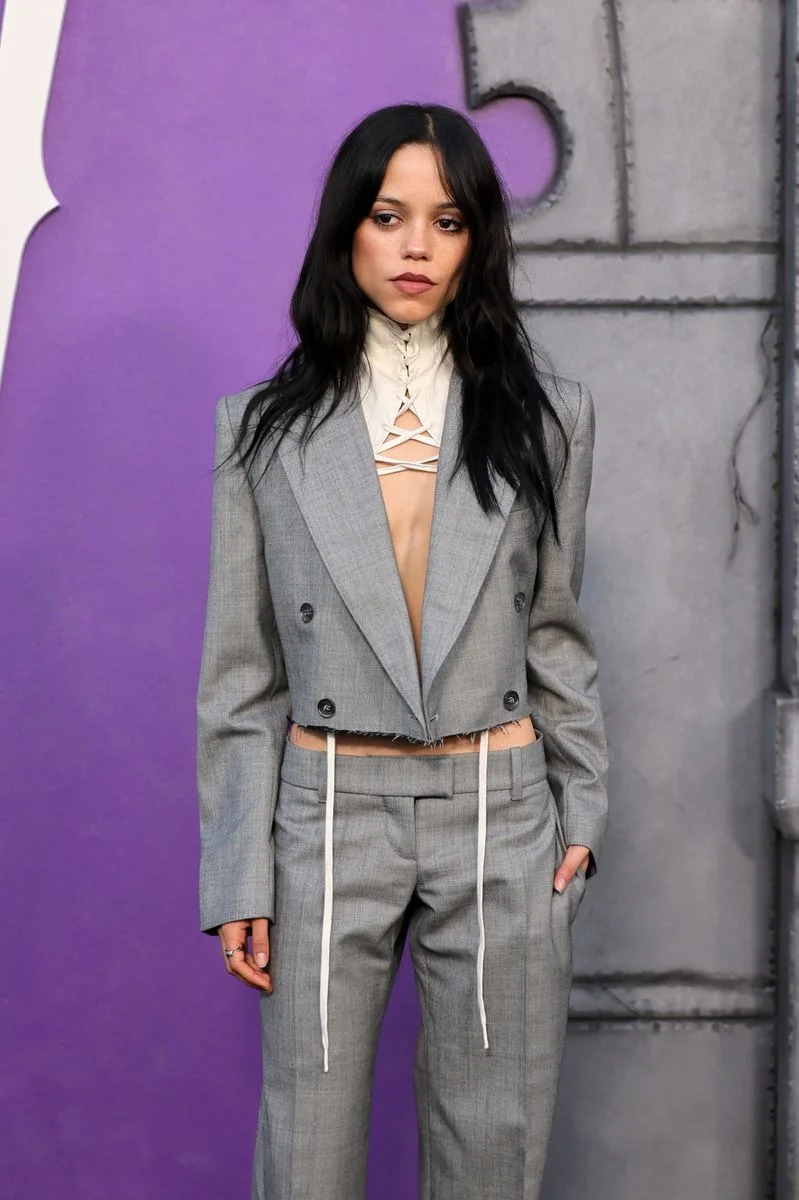 The structured piece extended outward across her chest before opening into a deconstructed silhouette