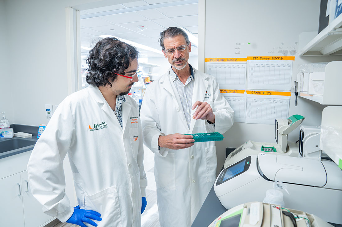 Dr. Jose Barrera-Paez and Dr. Carlos Moraes working in the lab