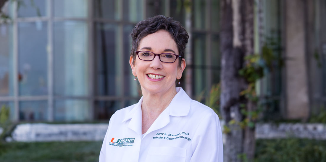 Dr. Kerry Burnstein in white clinic coat