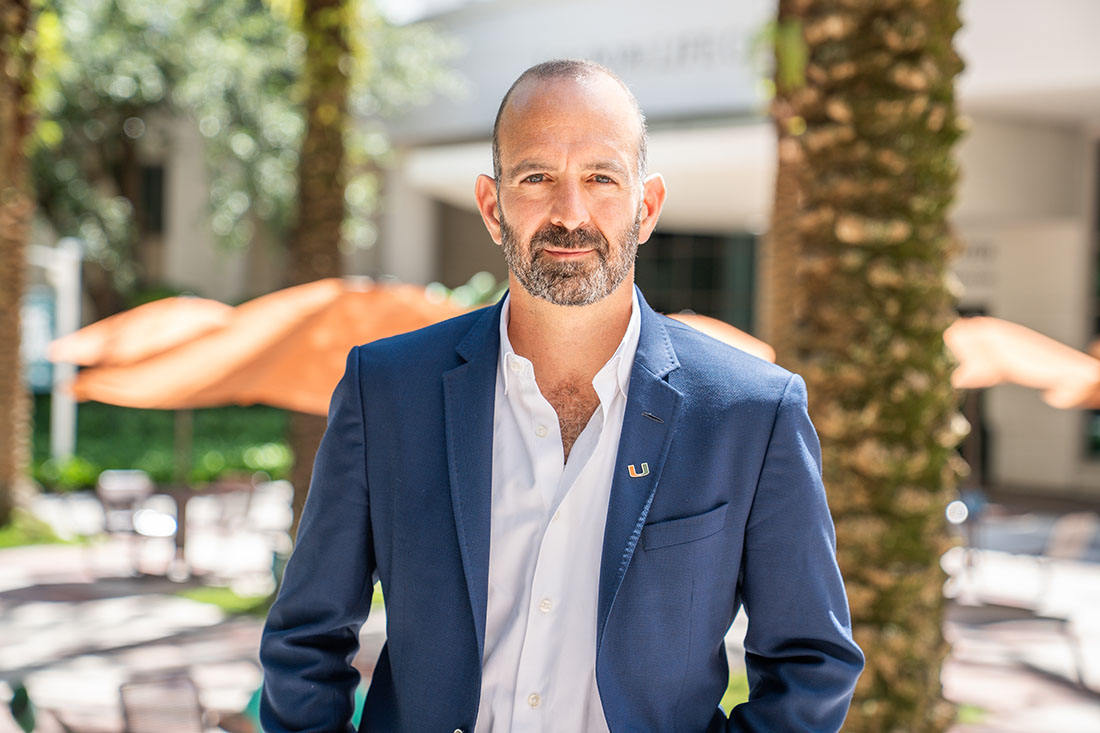 Miller School of Medicine Department of Cell and Systems Biology Chair Dr. Leor Weinberger in dark blazer, standing outside on the Miller School campus