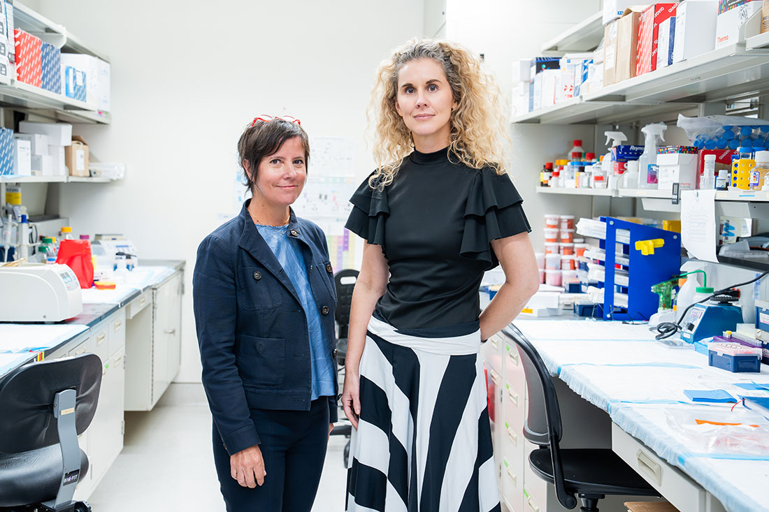 Dr. Alessia Fornoni and Dr. Alexis Sloan, standing side by side in a medical lab