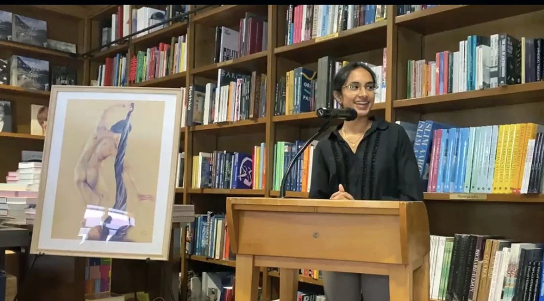 Miller School medical student Sneha Akurati presenting artwork during a classroom or lecture session.