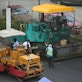Road construction work by workers with machinery in Malaysia