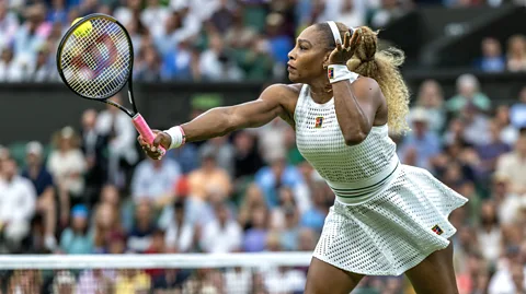 Getty Images Serena Williams hits a tennis ball during a Wimbledon match (Credit: Getty Images)