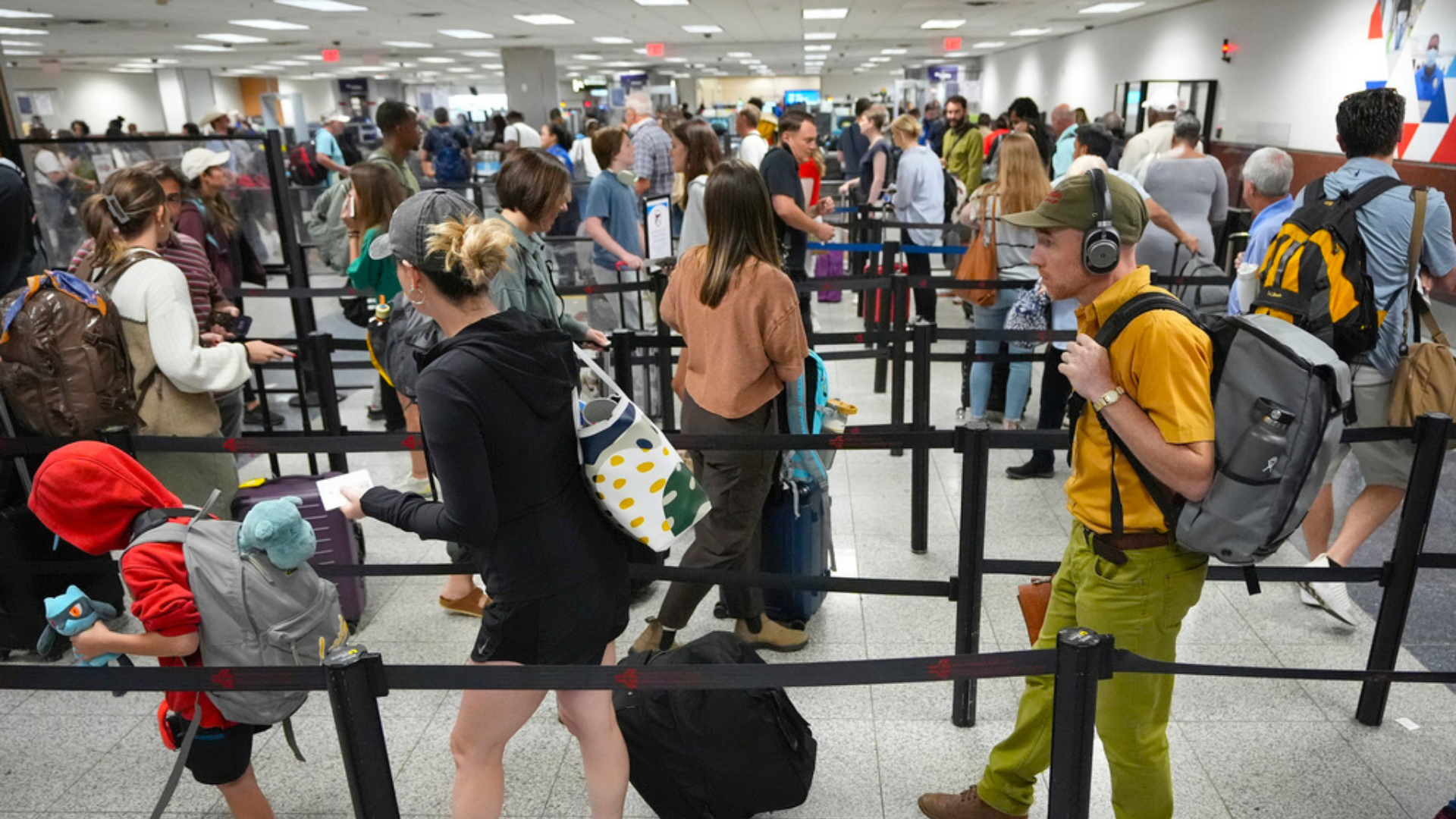 Travelers line up for security clearance at Hartsfield-Jackson Atlanta International Airport.