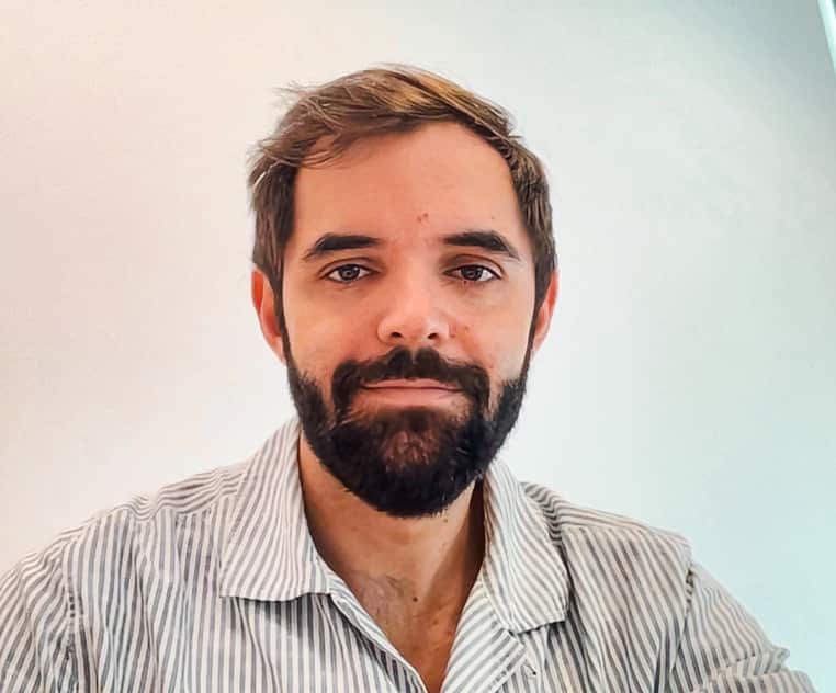 A man wearing a white striped shirt.