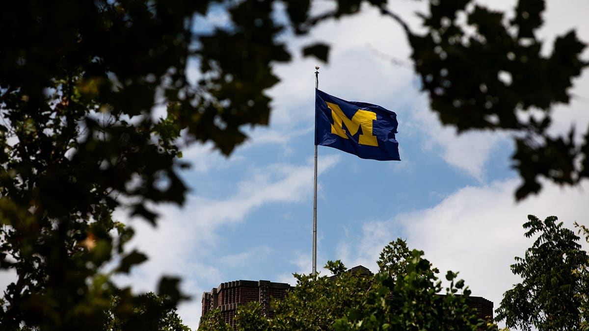 University of Michigan flag hangs on the Michigan Union building in Ann Arbor, Michigan.
