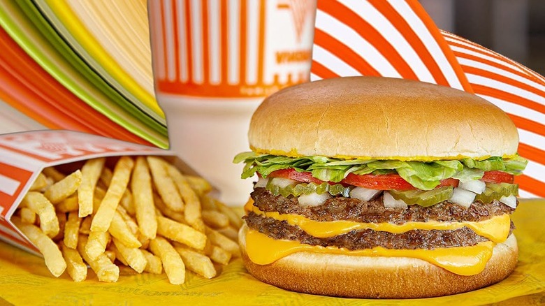 A double Whataburger with cheese, fries, and a drink.