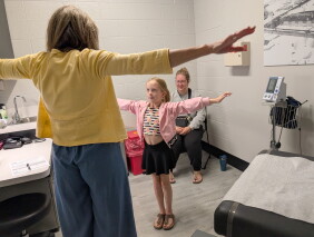 Physician assistant Shelley Littleton, left, conducts a sports physical for Leigha Eisler, 8, as Eisler's mother watches, at the Corunna Direct Primary Care clinic in Corunna, Mich., Aug. 19, 2026. (Robin Erb/Bridge Michigan via AP)