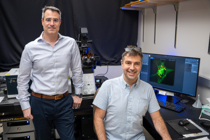 Portrait of Matt LaVoie and Adam Mamais in the microscope room.