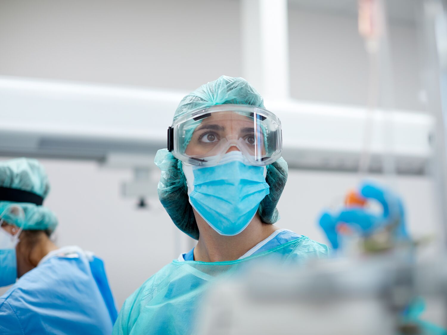 Healthcare worker wearing protective mask and glasses in a Hospital COVID ward.