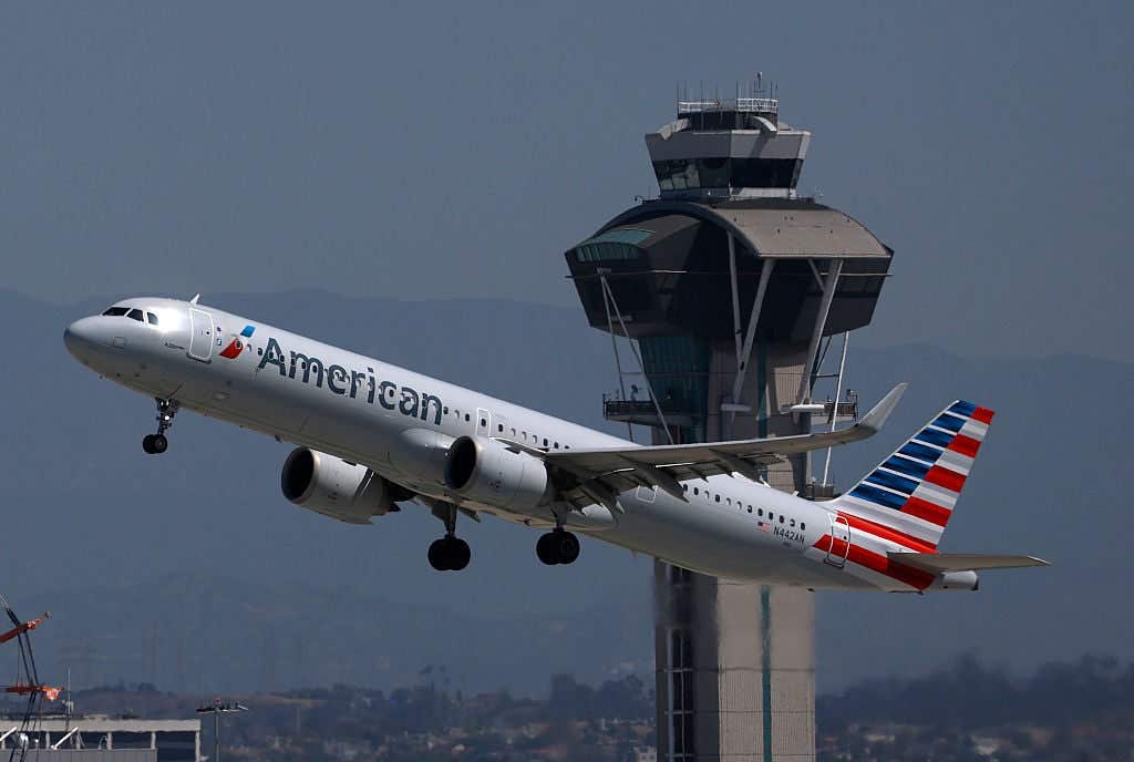 LOS ANGELES, CALIFORNIA - APRIL 23: An American Airlines plane takes off from Los Angeles International Airport on April 23, 2026 in Los Angeles, California. American Airlines reported first-quarter earnings that beat analyst expectations with revenue of $13.91 billion compared to an anticipated $13.79 billion, and cut its 2026 earnings forecast as surging jet fuel prices are expected to add roughly $4 billion in costs this year. (Photo by Justin Sullivan/Getty Images)
