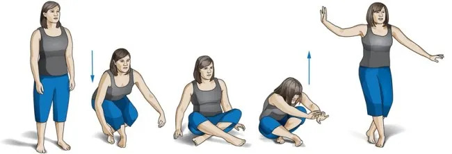 Woman sitting on ground.