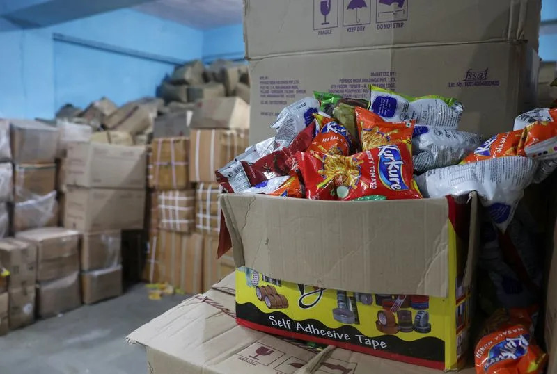 Maharashtra Food and Drug Administration officials raid a warehouse in Turbhe