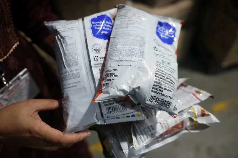 Maharashtra Food and Drug Administration officials raid a warehouse in Turbhe