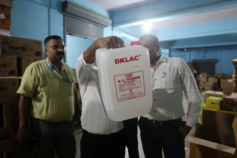 Maharashtra Food and Drug Administration officials raid a warehouse in Turbhe