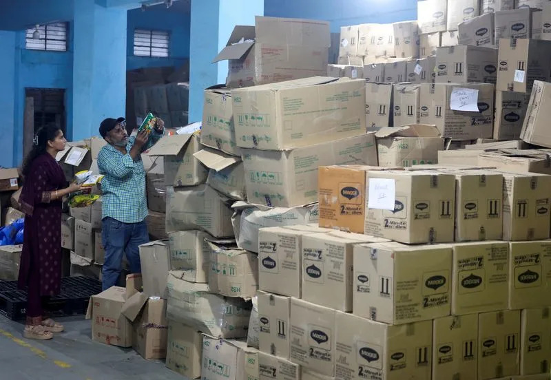 Maharashtra Food and Drug Administration officials raid a warehouse in Turbhe