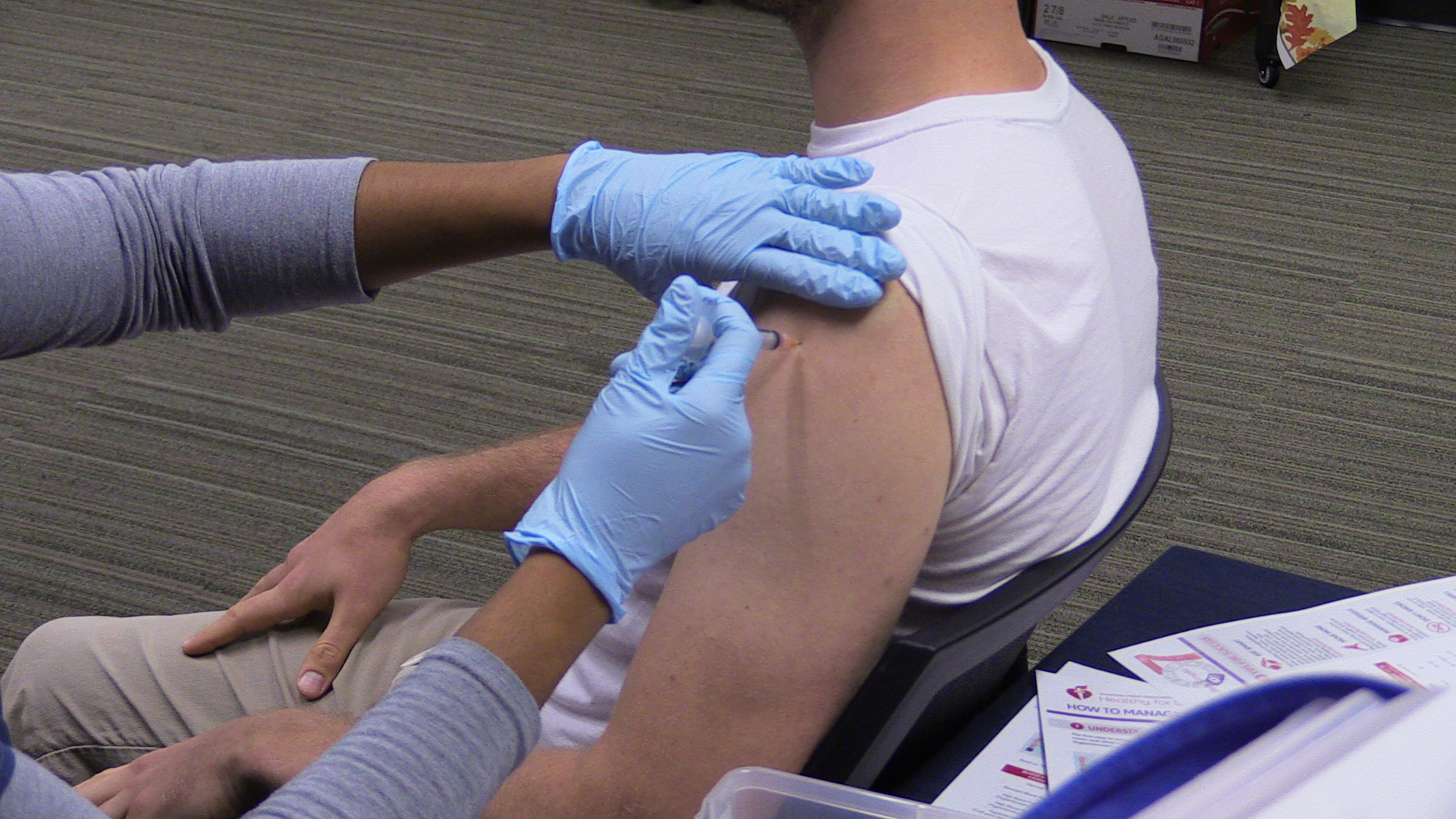 Flu shot -applying bandage close up