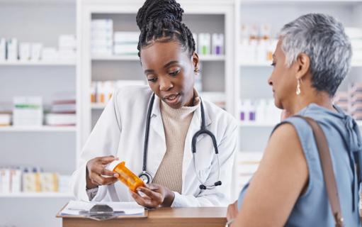Pharmacist discussing medication with person